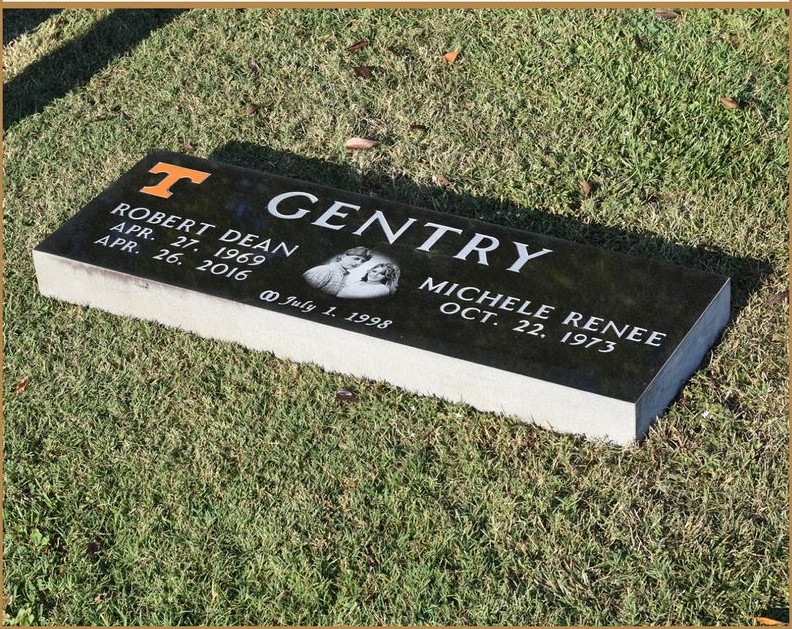A flat granite companion marker lettered GENTRY