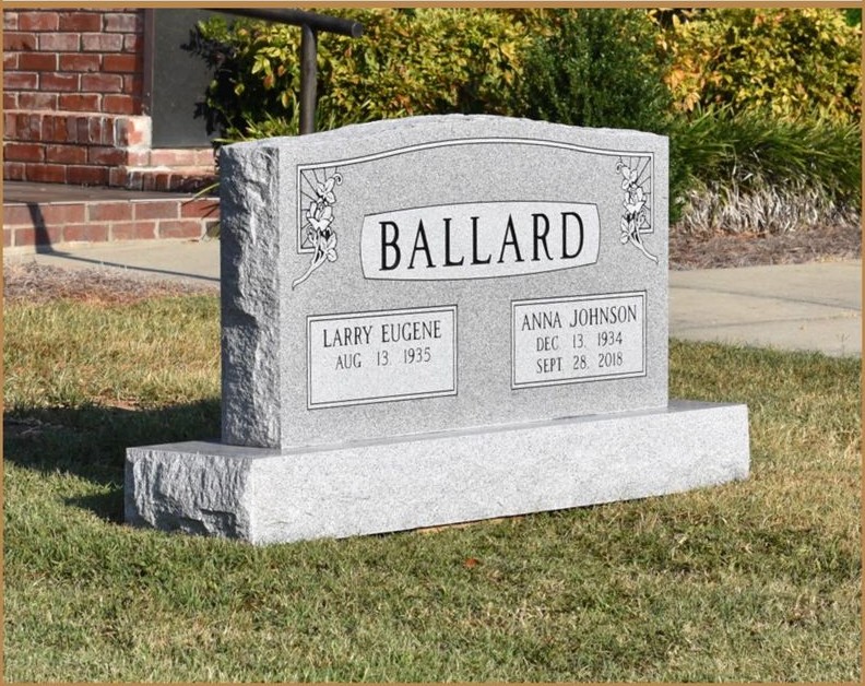 A light grey companion upright monument lettered BALLARD, standing in a cemetery